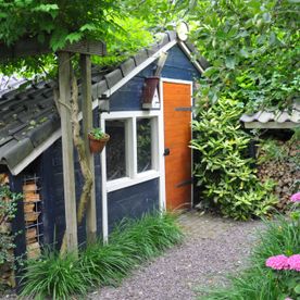 Tuinhuisje bij dijkwoning